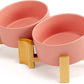SPUNKYJUNKY 15° Slanted Ceramic Dog and Cat Bowl with Wooden Stand, Tilted Bulldog Food and Water Bowl No Slip Non-Spill for Cats Medium Dogs Big Face Pets 28.7 OZ (3.6 Cups, Pink × 2)