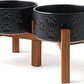 SPUNKYJUNKY Ceramic Elevated Dog Bowl Set with Acacia Wood Stand for Food and Water for Small Medium Sized Dogs (28.74 OZ, Black, Dog Paw Pattern)
