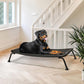 Veehoo Outdoor Elevated Dog Bed, Cooling Raised Dog Cot Bed XL, Portable Waterproof Curved Dogs Hammock Beds for Outside, up to 150lbs, Black Legs, Black 49"