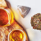 Grace Farms SETTLE Wellness Organic Tea Blend (100 Enveloped Pyramid Sachets w/ String & Tag) | Peppermint Cacao | Relaxing and Digestive Support | Fairtrade and Kosher | Filled With Antioxidants and Stress-Relieving Herbs | Gives Back 100% of Profits