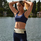 WATERFLY Running Belt Fanny Pack: Slim Waist Bag for Men Women, Workout Fitness Phone Holder for Exercise Marathon Jogging-Beige