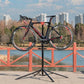 CXWXC Bike Repair Stand - Bicycle Stand For Maintenance Workstand - Ebike Repair Stand Shop Home Mechanics for Mountain Road Bike and E Bike (Black)