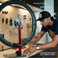 FEEDBACK SPORTS | Pro Truing Stand with Thru Axle Adapter | Compact and Portable Lightweight Aluminum | Integrates With Repair Stand | Precision Spring-Loaded Tip Verifies Lateral True